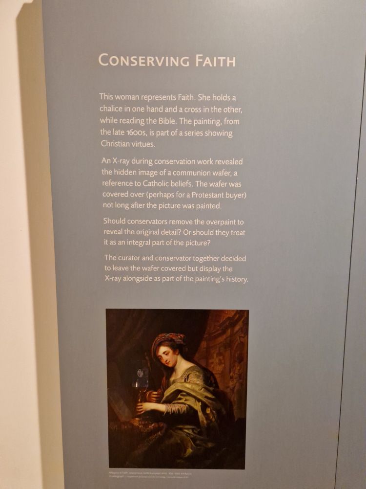 Museum panel explaining how praying a painting revealed a secret