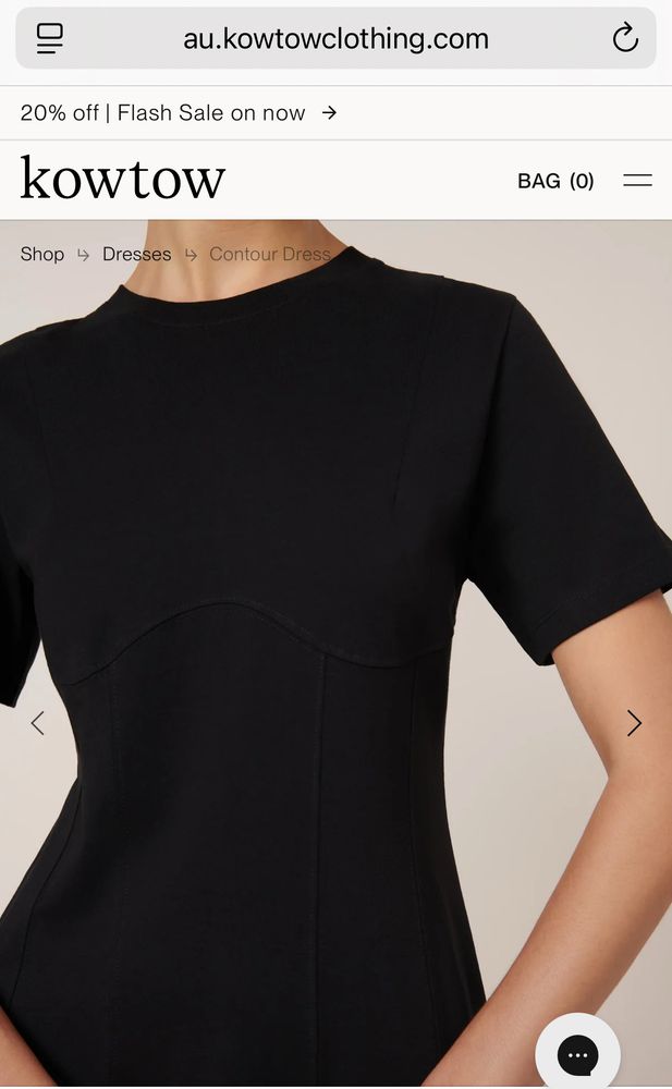 Screenshot of a website with a black dress contoured over the bust.
