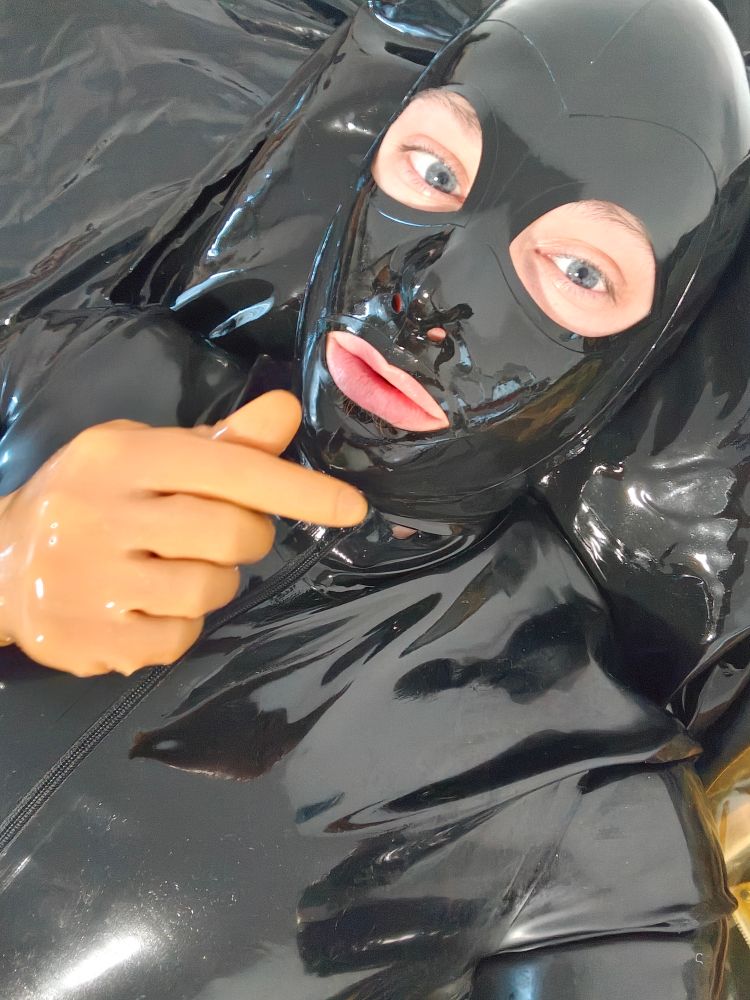 Me in fullrubber making a finger heart