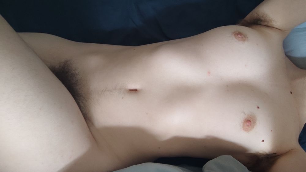 L is laying naked on his bed
You can see his round perky boobs, his hairy pits, his happy trail and a bit of his thick bush peeking from behind his squishy thigh.
He looks delicious. 
