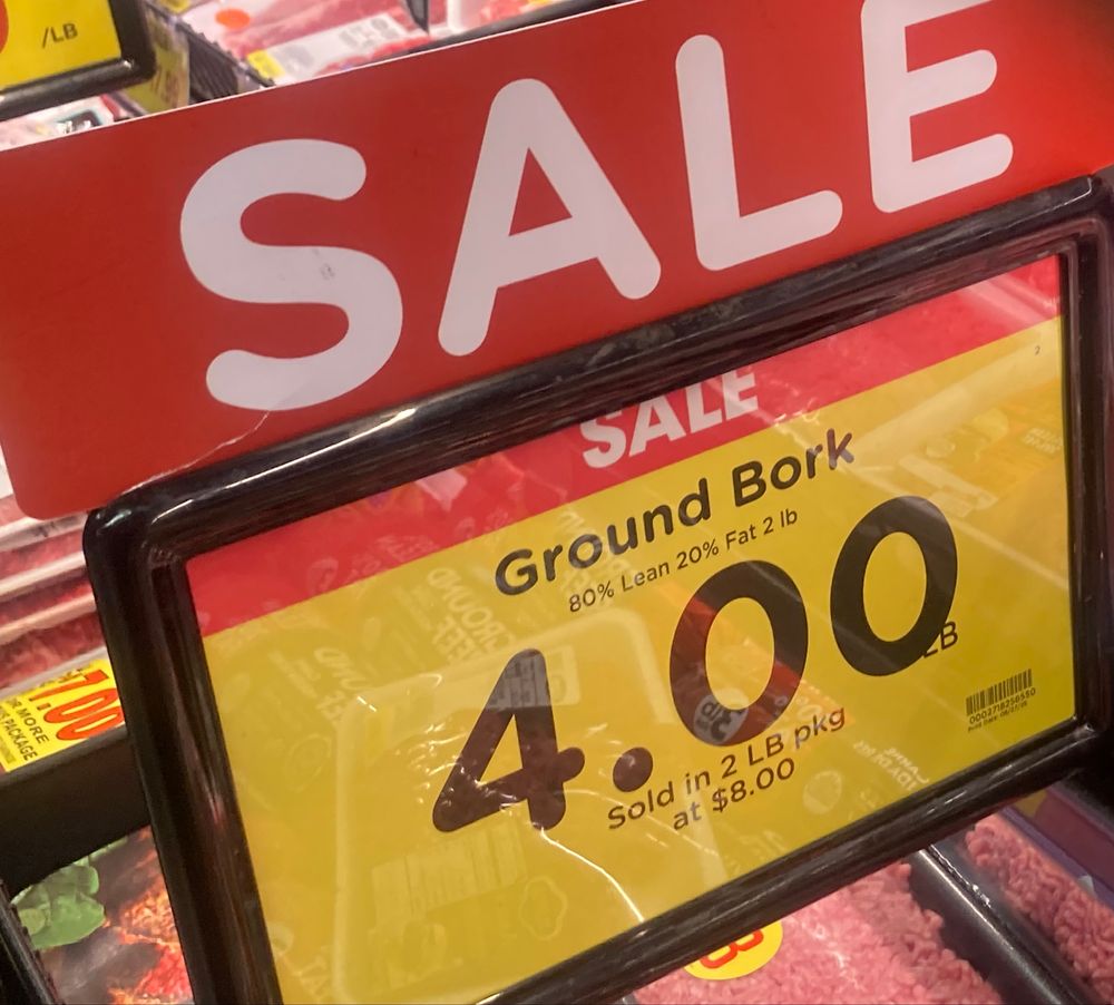 Sign in meat department: Sale, Ground Bork, $4.00.