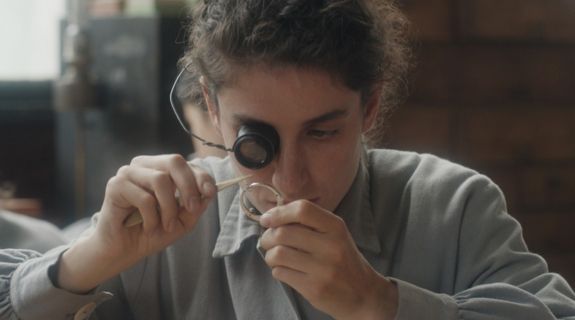 A woman with eyeglass.