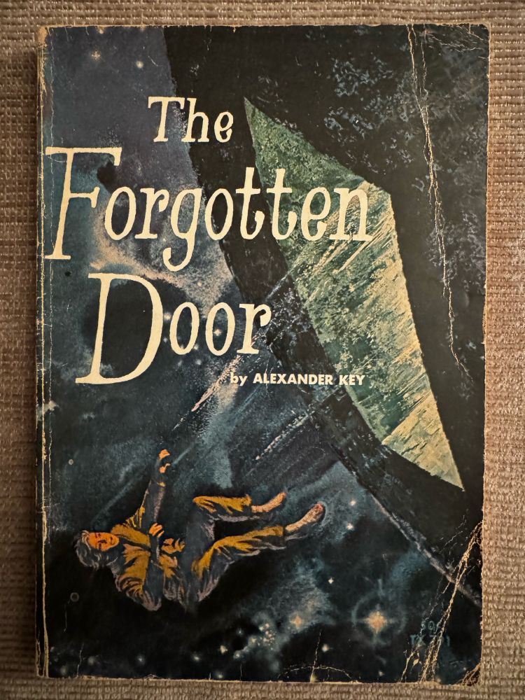 Cover of the non The Forgotten Door by Alexander Key, showing a man falling into space. 