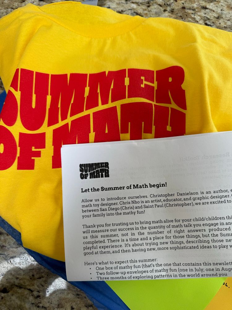 Bright yellow tshirt in background with red “summer of math”. Letter in foreground saying welcome to summer of math. 