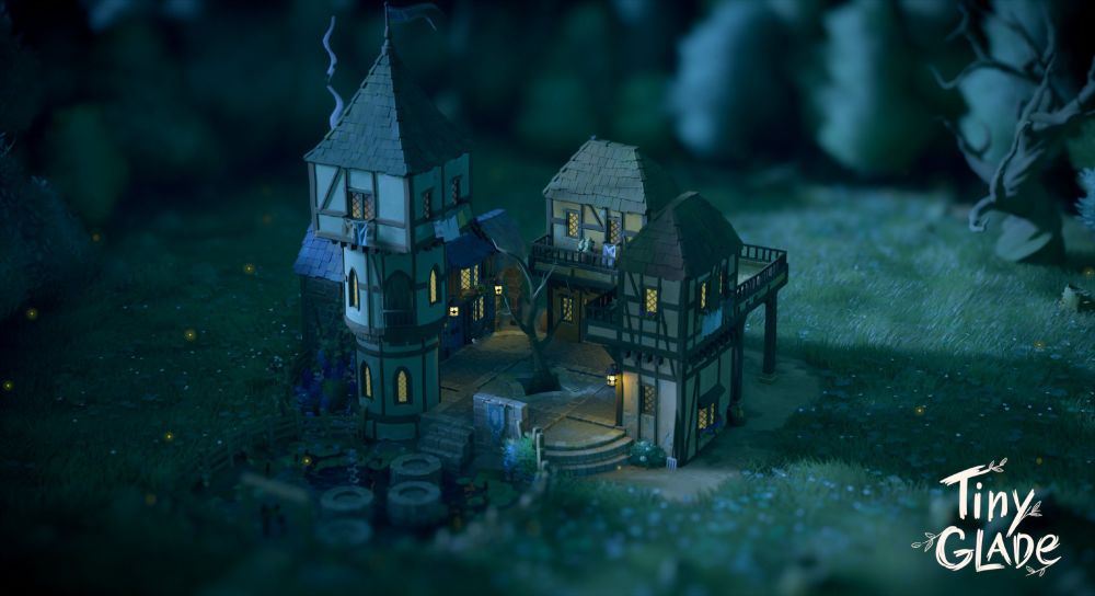 A small town square built in the game Tiny Glade, including a tall round tower with a square room on top, two small two-storey buildings with a shared balcony area, and a larger barn-like building with a blue roof. There is a small pond with circular stepping stones, surrounded by a short brown fence. It is night time, and the scene is lit by lanterns and moonlight.