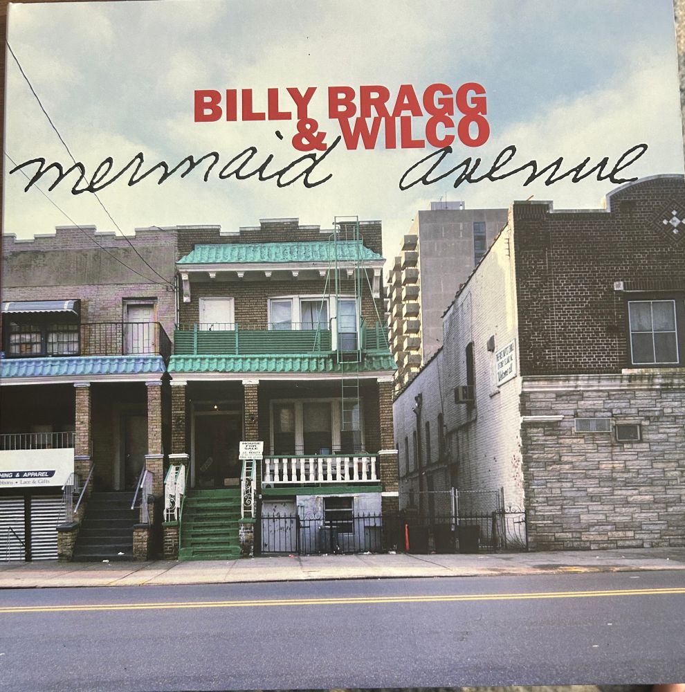 Cover of Mermaid Avenue album by Billy Bragg and Wilco putting music to Woody Guthrie lyrics.