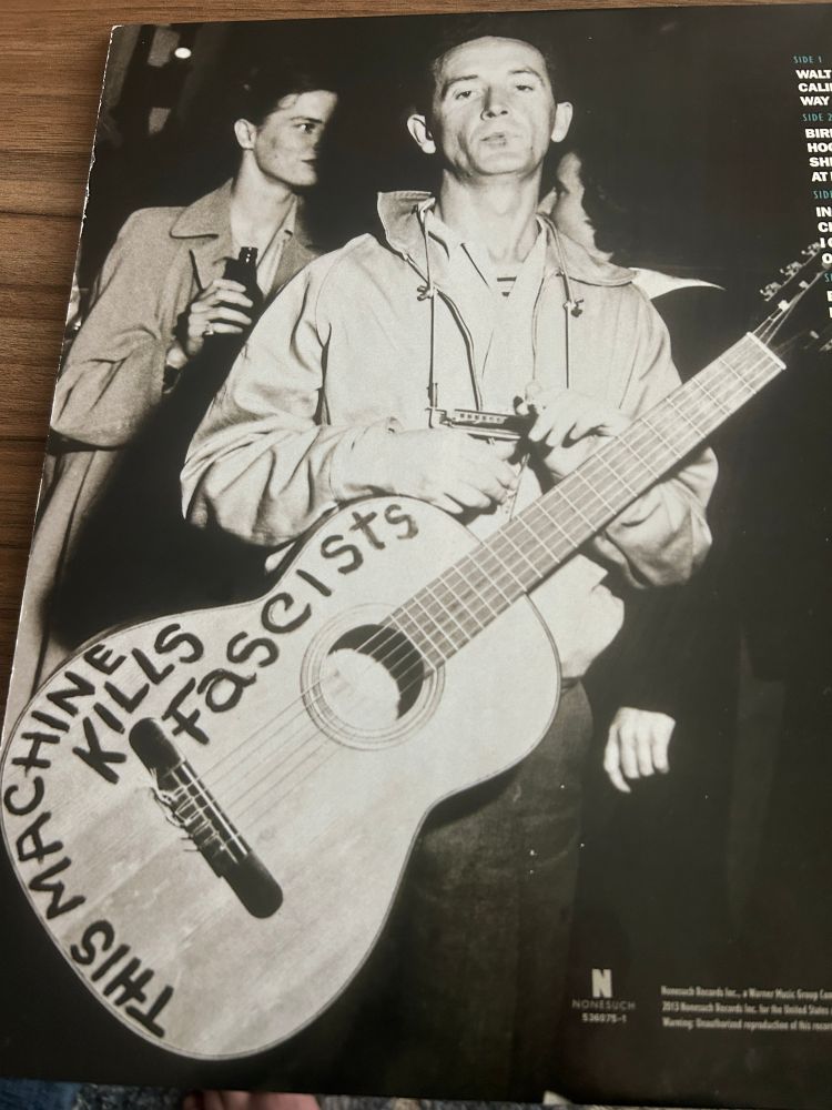 Picture if Woody Guthrie on the back of Mermaid Avenue vinyl 