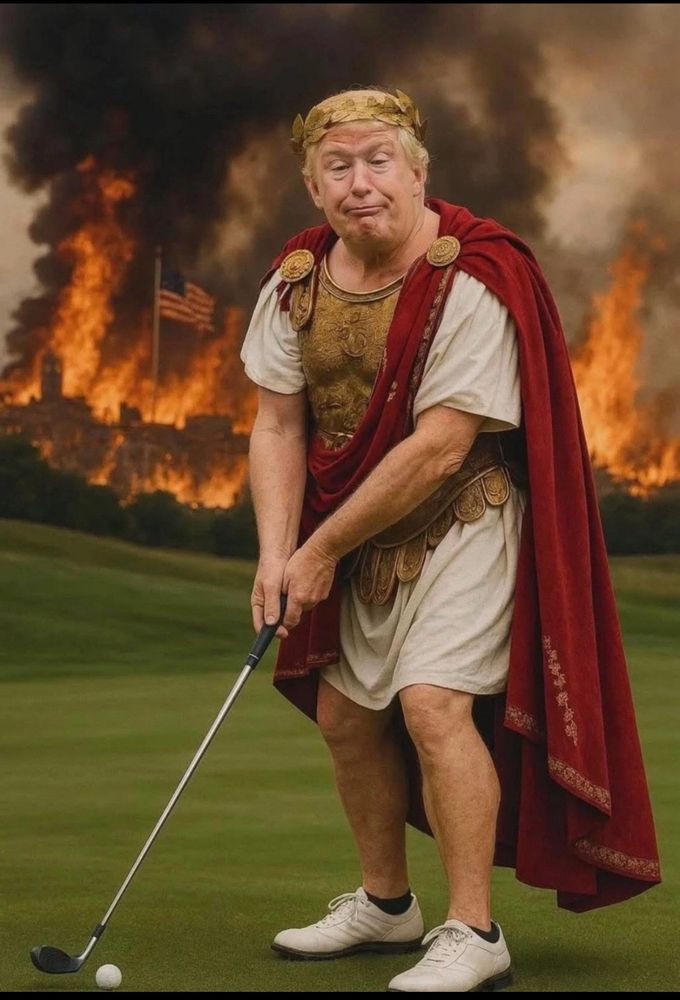 Drumpf on a golf course, smirking, wearing a Roman Emperor’s robe with the background landscape being incinerated by a raging fire, including an American flag 