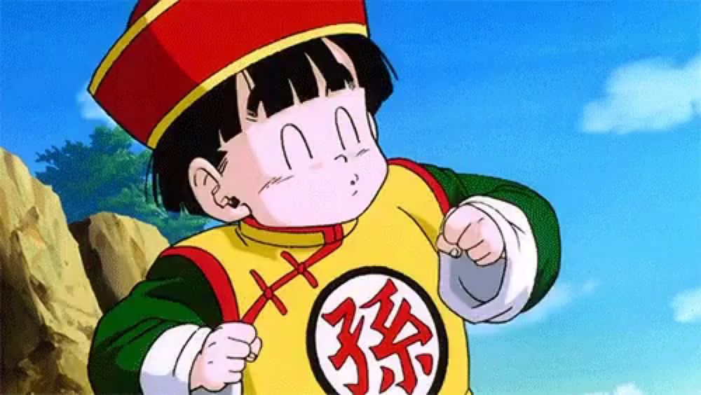 a cartoon character from dragon ball z is wearing a yellow shirt with chinese characters on it