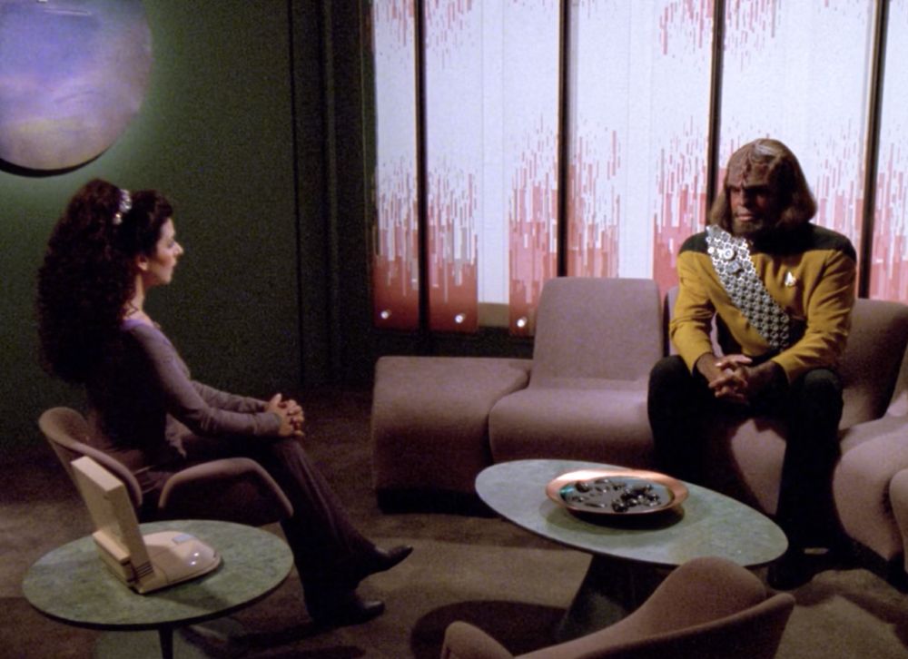 A still from Star Trek: The Next Generation. Worf, son of Mogh, is in therapy with Counselor Troi.