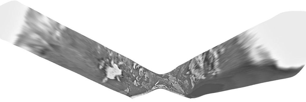 This image is a roughly reprojected version of the Venera 10 panorama. It approximates a map geometry and the narrow central part is about 2 m across. It shows the lander sitting on a patch of flat rocky slabs with similar rocky areas on each horizon (probably not very far away, a few tens of meters). Between them is a smooth-looking dark surface, probably gravelly in texture like small patches in the foreground.