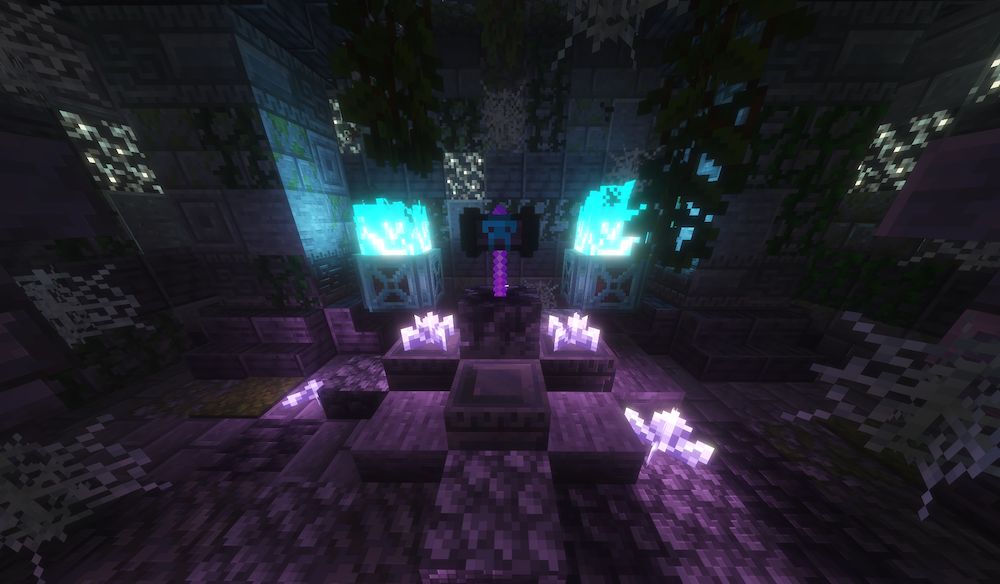 A dark, creepy dungeon, dimply lit by soul fire in the back and amethyst at the base of a stone pedestal. On the pedestal, there is an ancient hammer from the “Ancient Artifacts 2” mod. It has a purple handle and a black/dark gray head with an accent of what appears to be a skull.