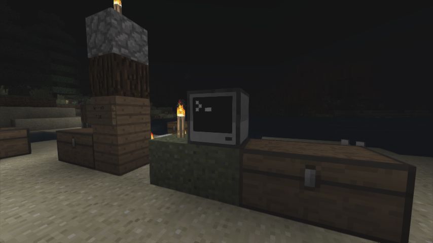 A Better than Adventure! screenshot featuring a few chests, a small pillar made of wood and cobblestone, and a computer from the Better than Adventure! version of CC: Tweaked.