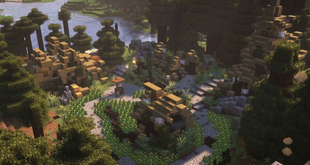 An overhead shot of a ruined Japanese village. It had several abandoned structures, looking decayed with webs and vines growing along the sides.