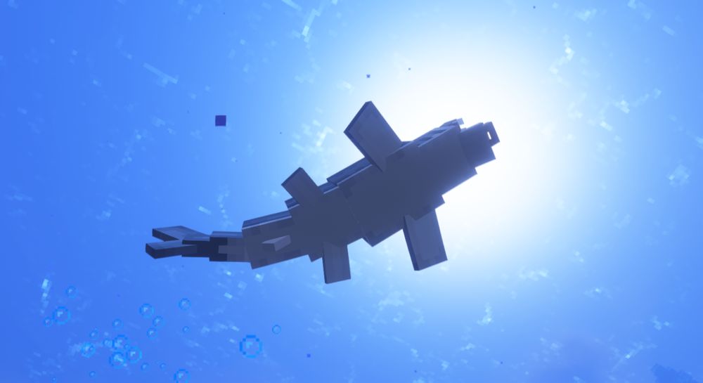 In-game view from below a shark in the ocean with the sun shining down from above