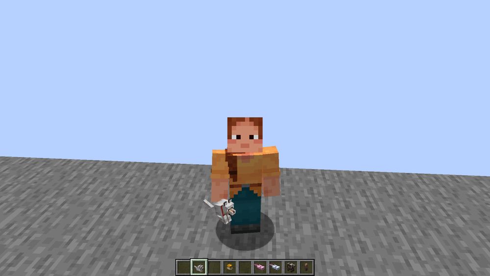 A player holding a wolf as an item.