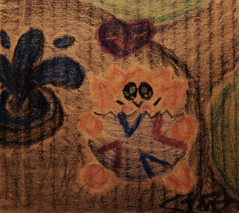 A crayon drawing of Togepi playing next to a fountain at a park.