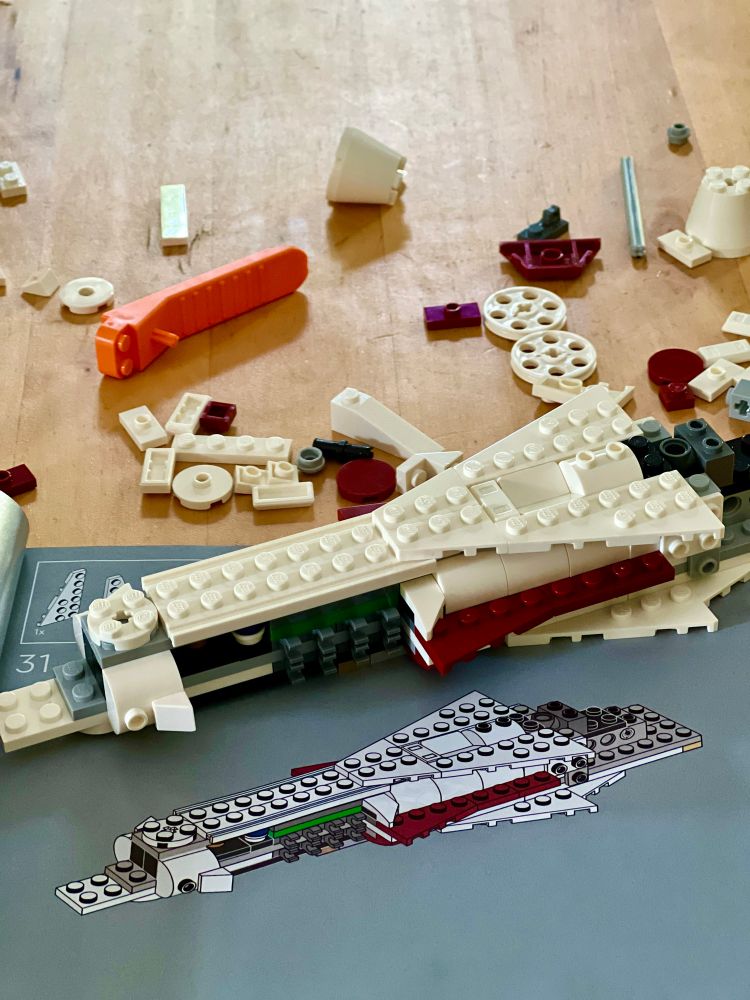 Legos Star Wars set being constructed 