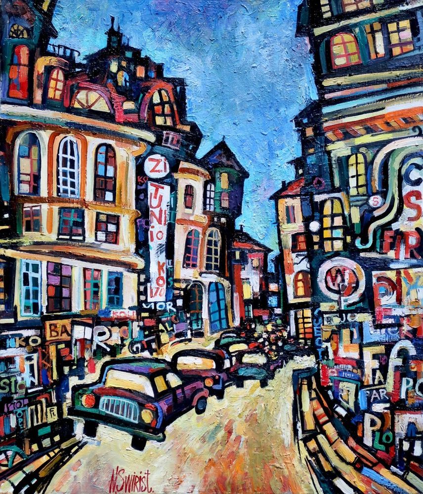 "Colourful evening. Paris" by Nikifor Swiristuhin is a bold, colorful oil painting which shows a view of a street in Paris. There are two tall Parisian buildings on each side, with the street in the middle, filled with cars & a bit of sky up in the distance. Everything is very colorful with random letters painted throughout.