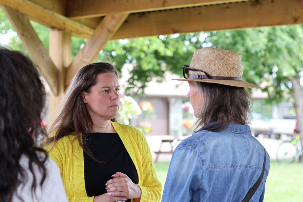 MLA Sweet speaking with a constituent.