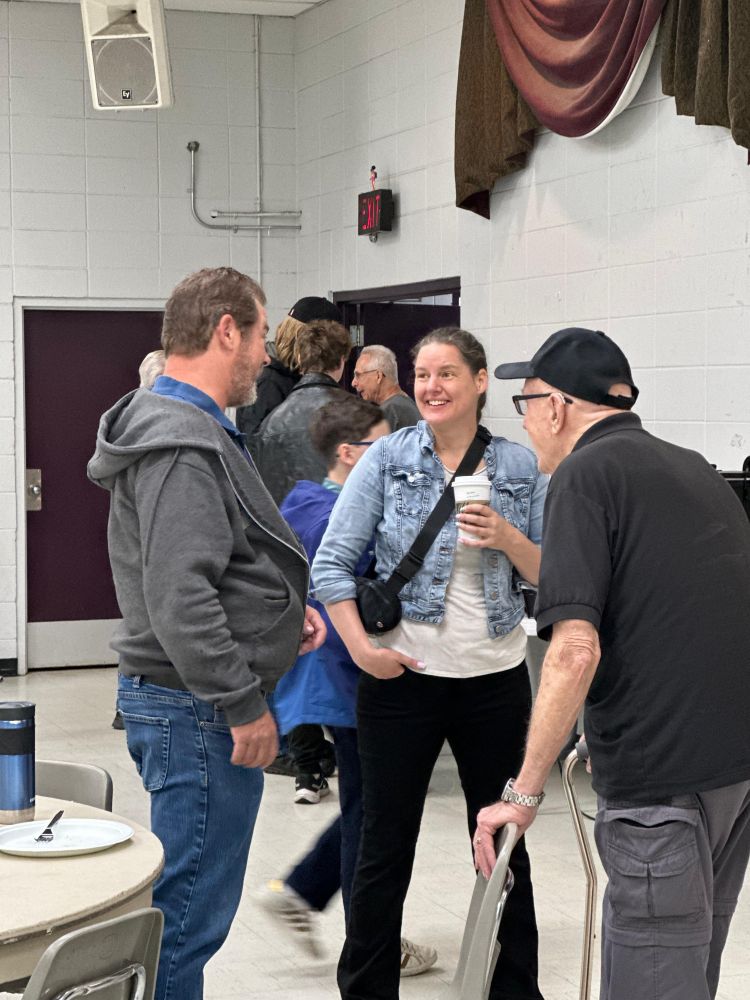 MLA Sweet speaking with attendees