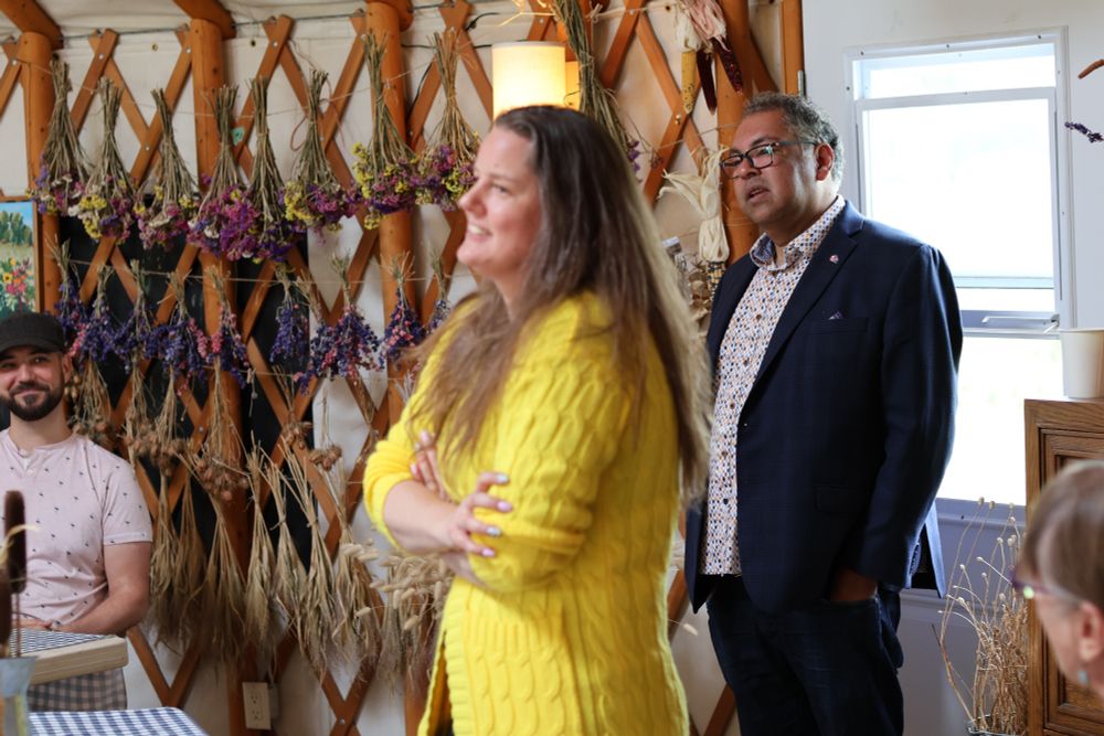 MLA Sweet and Leader Nenshi standing in front of attendees.