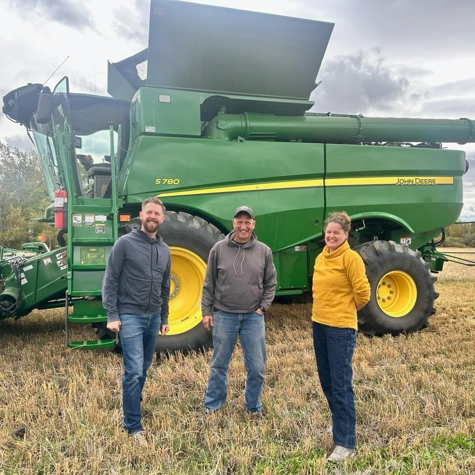 MLA Sweet and MLA Kasawski at a canola farm with Roger Chevraux from the Alberta Canola Producers Commission.