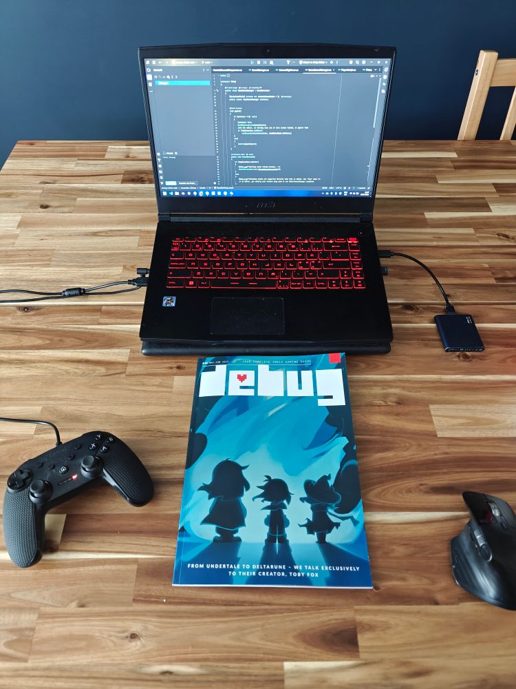 Debug magazine in front of my little Unity project on my laptop 