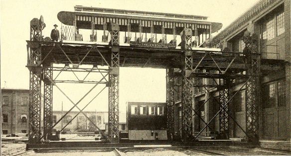 Side view of a railroad transfer table with truss girder towers to raise the track between two levels