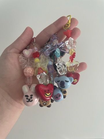 A handful of keychains featuring the various BT21 characters.