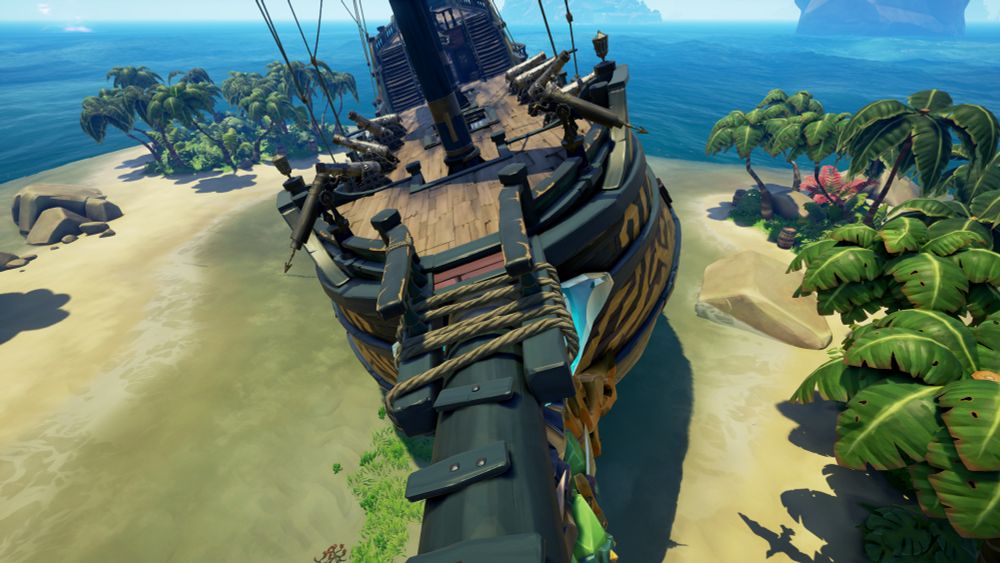 A sea of thieves galleon accidentally parked on the shallow water of Mutineers Rock. Islands to the left and right and the galleon is stuck in the middle of the sandbank between the small islands. 