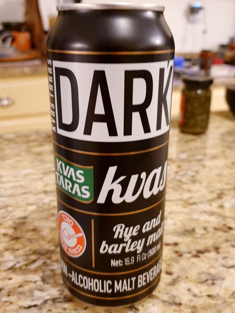 English-language-design can of Kvas Taras Dark on a kitchen countertop.