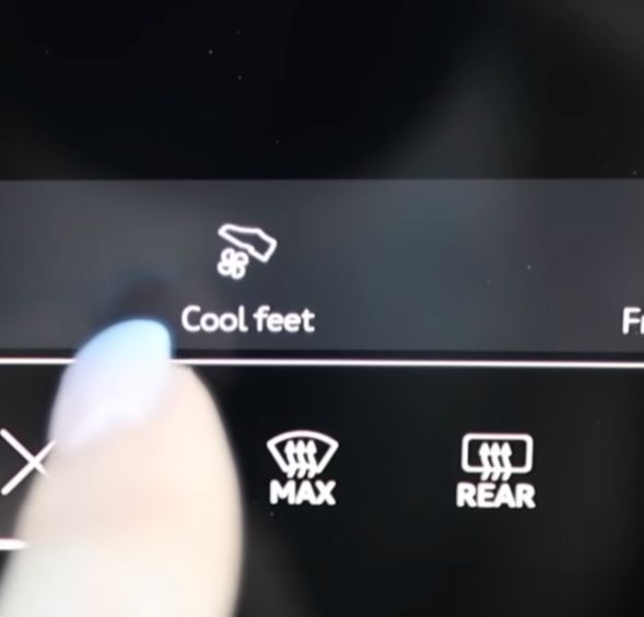 a manicured finger points to the 2025 Audi SQ6 e-tron climate control menu option to "cool feet" showing a foot stepping on a blade, wesley snipes gonna be pissed