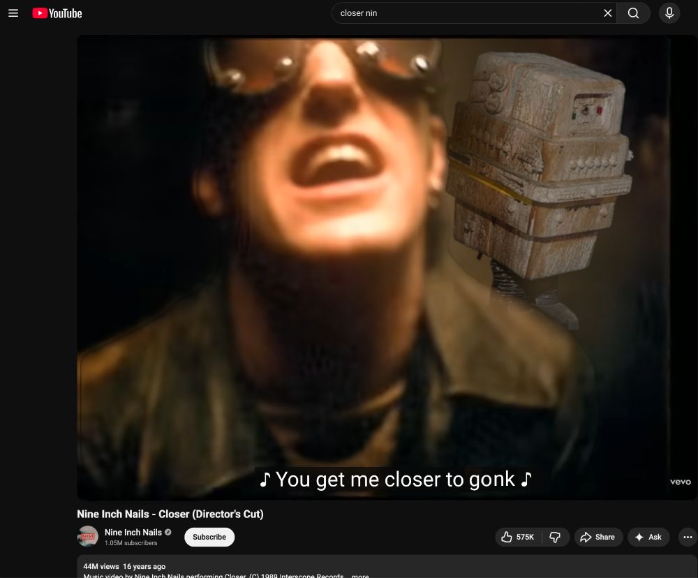 Youtube video player for Closer by NIN with T. Rezz in goggles singing:
🎵You get me closer to gonk 🎵 with the power droid from Star Wars just over his shoulder (GONK!)