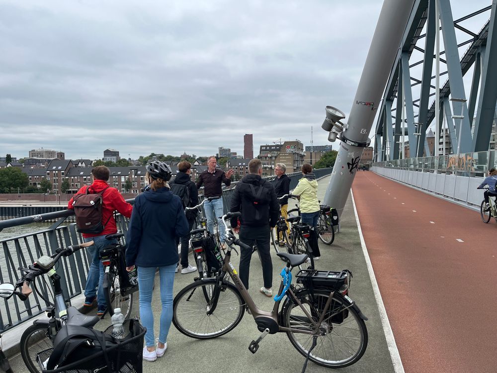 group stopped on cycle bridge