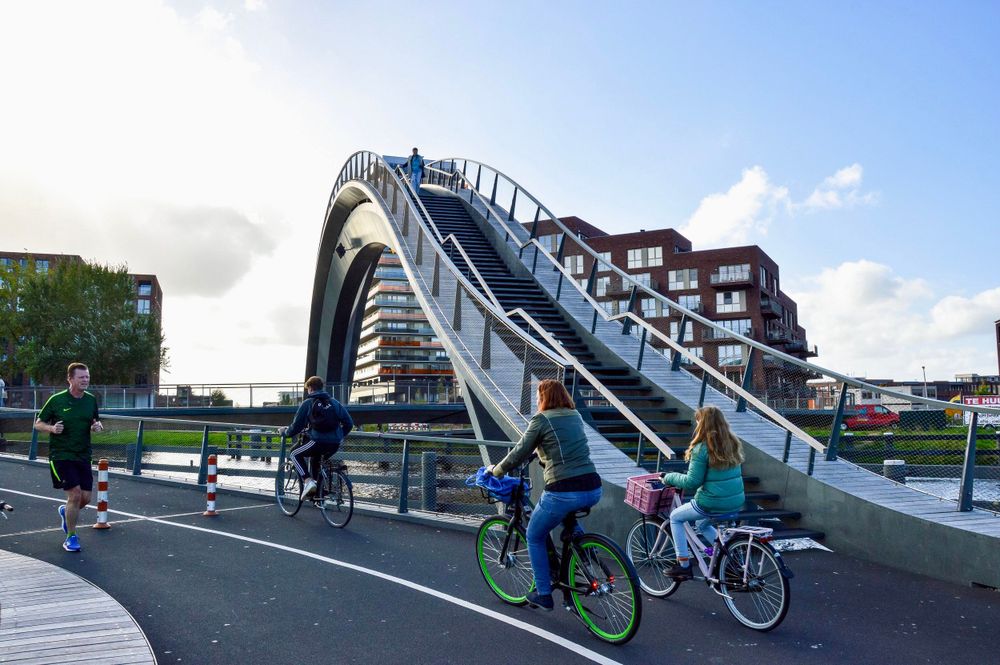 two bridges, one very tall one for pedestrians and a flat one for cyclists