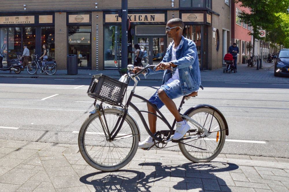man riding bike on street