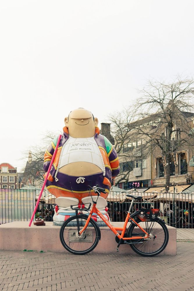 Bike in front of sculpture