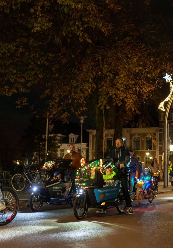 Cyclists at night with bikes lit up with twinkle lights