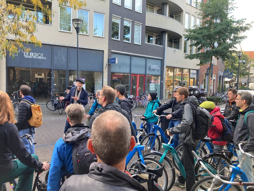 group standing with bikes
