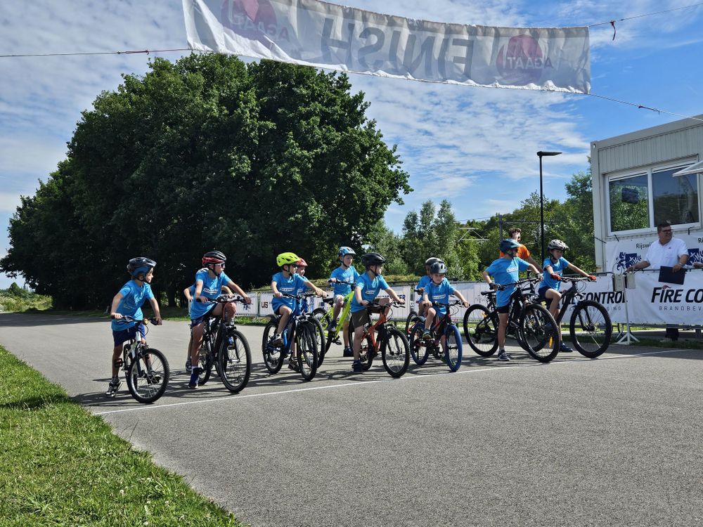 Kids on a start line wearing matching blue t-shirts