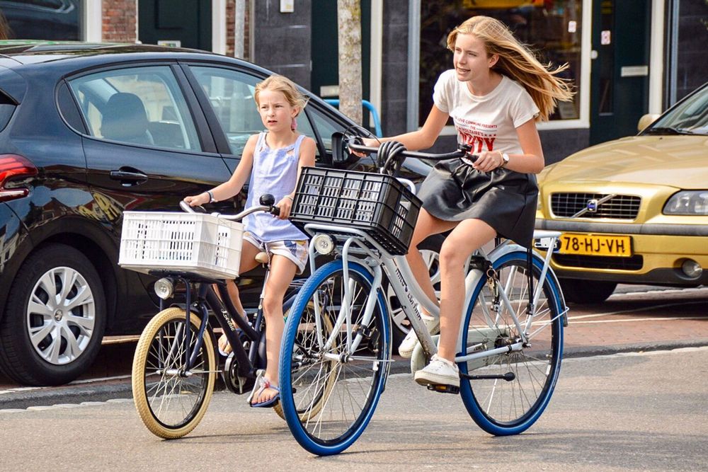 Two kids riding bikes