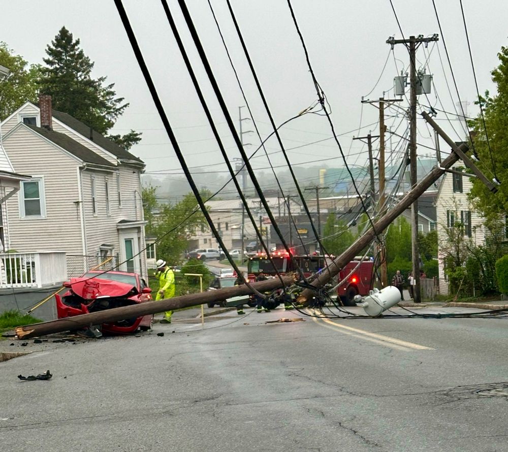 Chaotic results of an ICE raid, fallen telephone pole, crashed car, emergency vehicle 