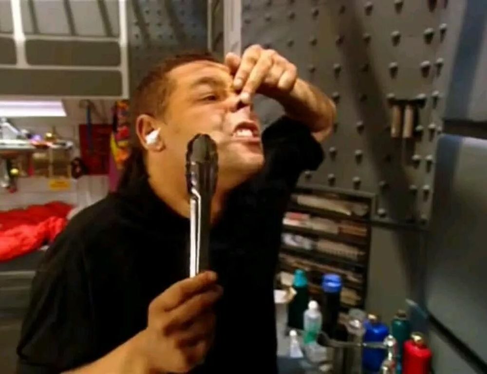 Red Dwarf - Dave Lister, steel tongs in hand, opening nostrils in preparation for nose hair removal
