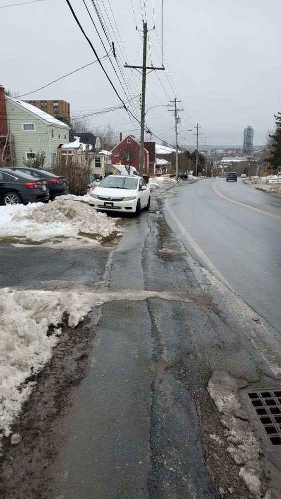 Car parked on the sidewalk