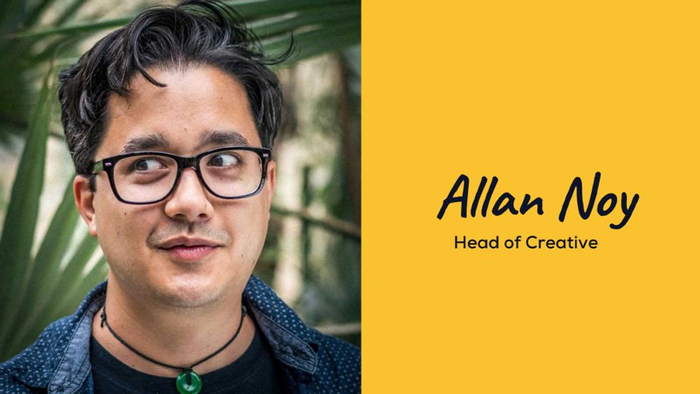 A picture of Allan, wearing a blue shirt and black glasses. He is standing in front of green foliage and smiling. He is accompanied by a yellow box next to him which says the words, 'Allan Noy, Head of Creative. 