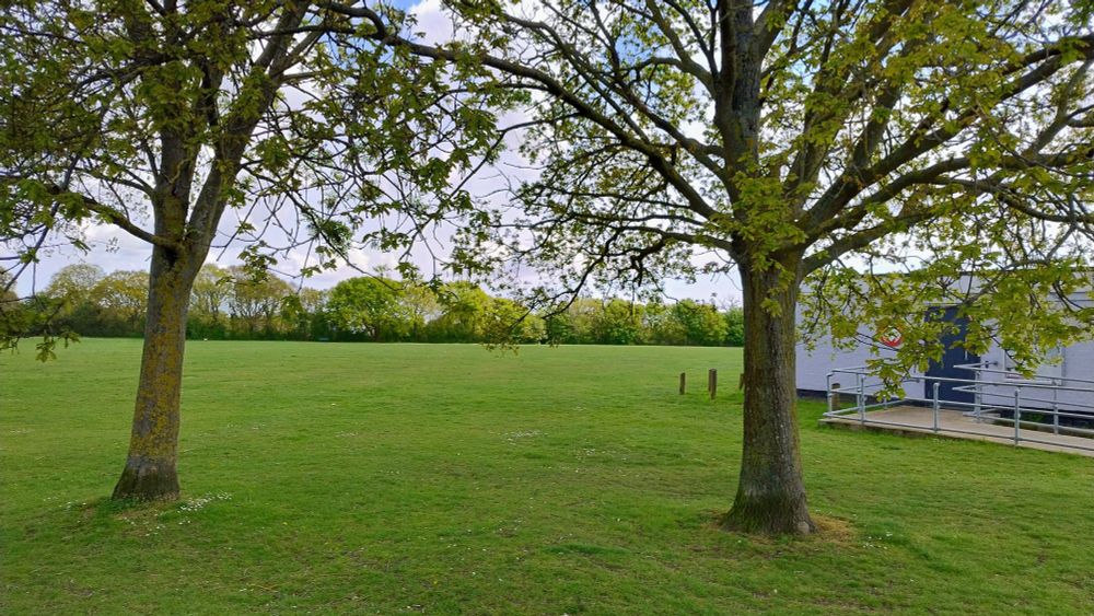 A view of the Hackspace and playing field on a warm Spring day.