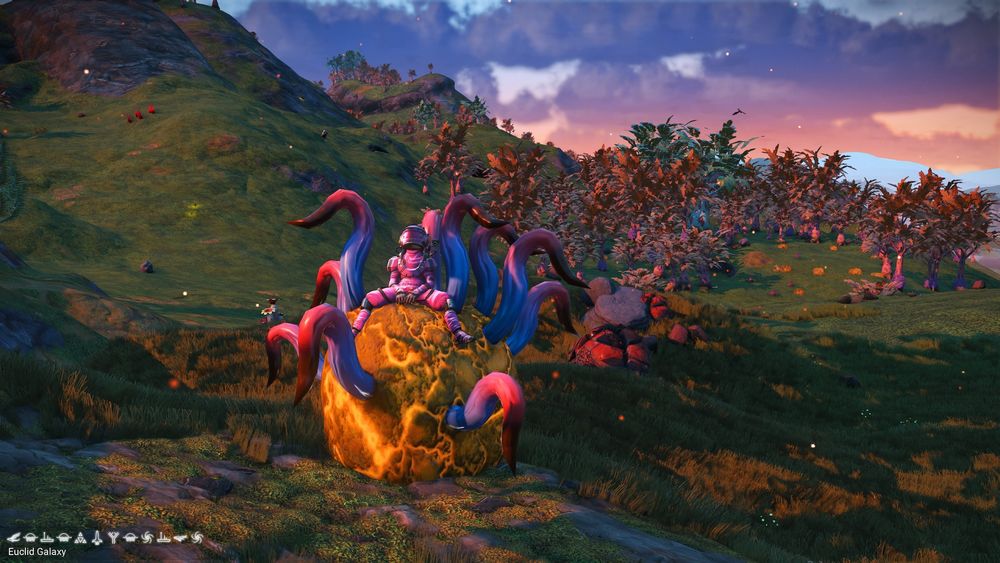 pink space suit riding on a gold blob with pink and blue tentacles