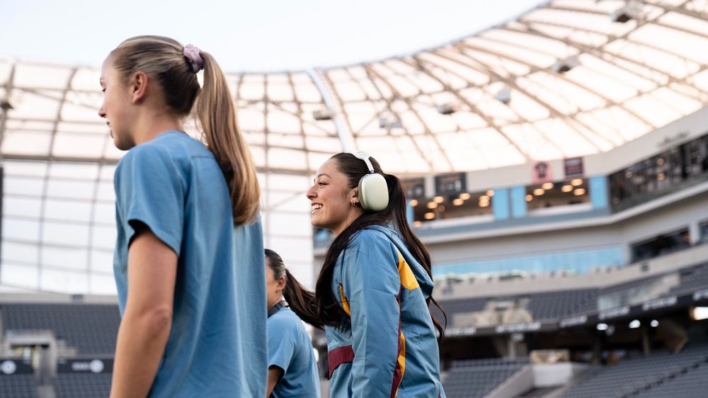 Alex and Kate walking on the field at BMO Stadium