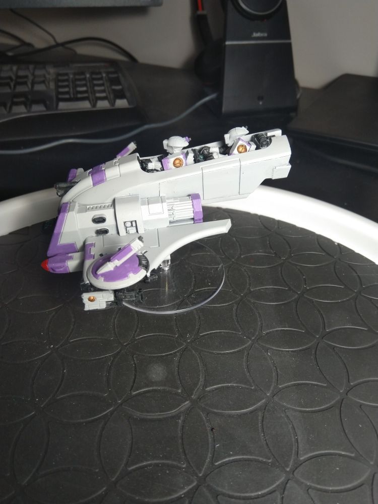 A painted Warhammer 40k T'au Empire Piranha miniature.